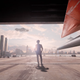 Spike standing in a jet hangar.